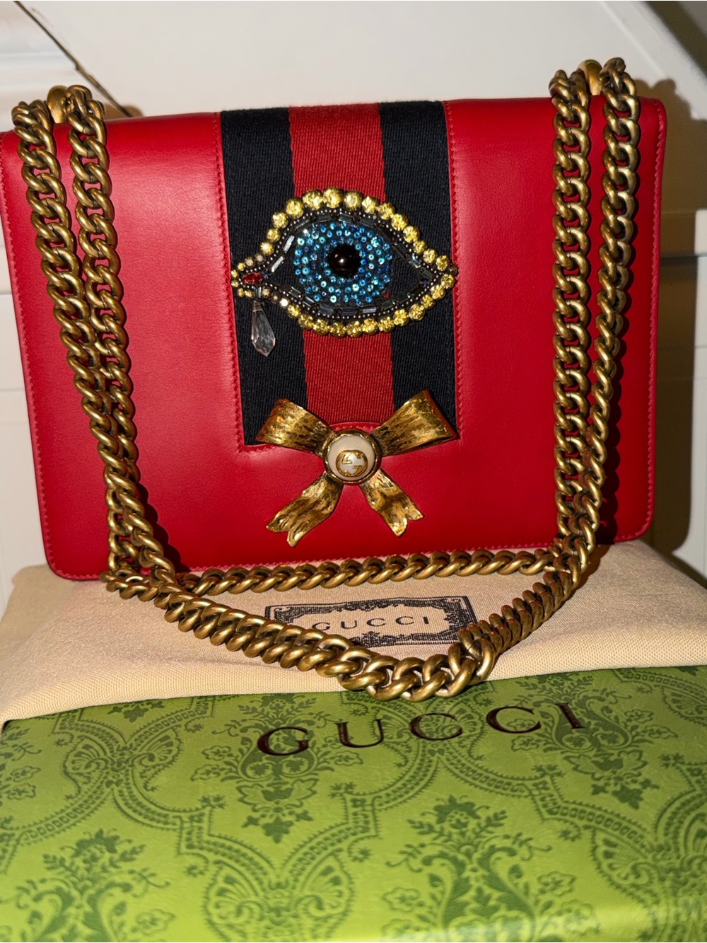 Gucci Red Leather Shoulder Bag with Gold Chain and Embellished Eye